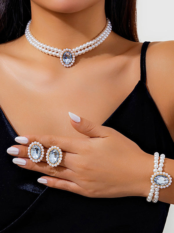 Parure collier et boucles d'oreilles géométrique superposée à strass
