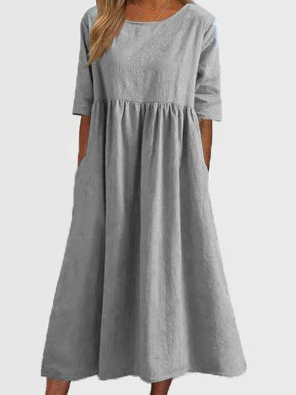 Robe mi-longue plissée coupe trapèze, à manches mi-longues, à poches, à col rond, couleur unie