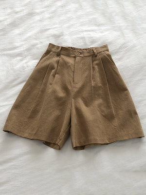 Short ample plissé à jambes larges, à taille élastique, couleur unie
