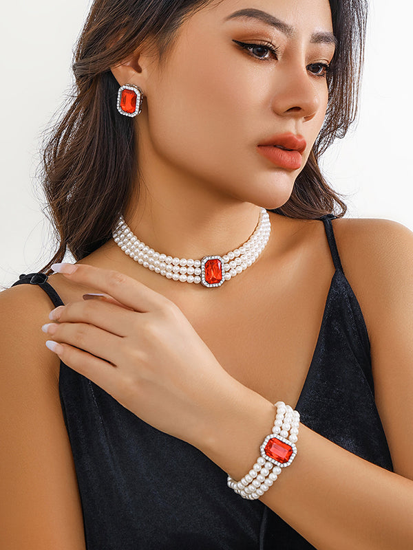 Parure bracelet, collier et boucles d'oreilles géométrique superposée à strass