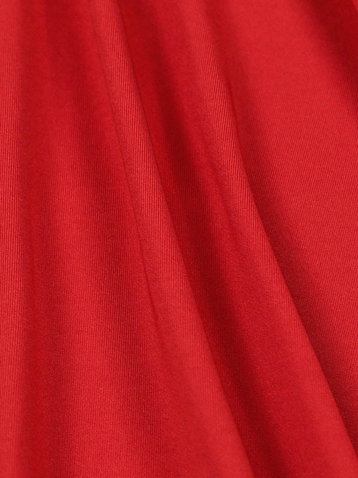 Robe courte plissée coupe trapèze, à taille élastique, dos nu, à empiècements, à décolleté en V profond, couleur unie