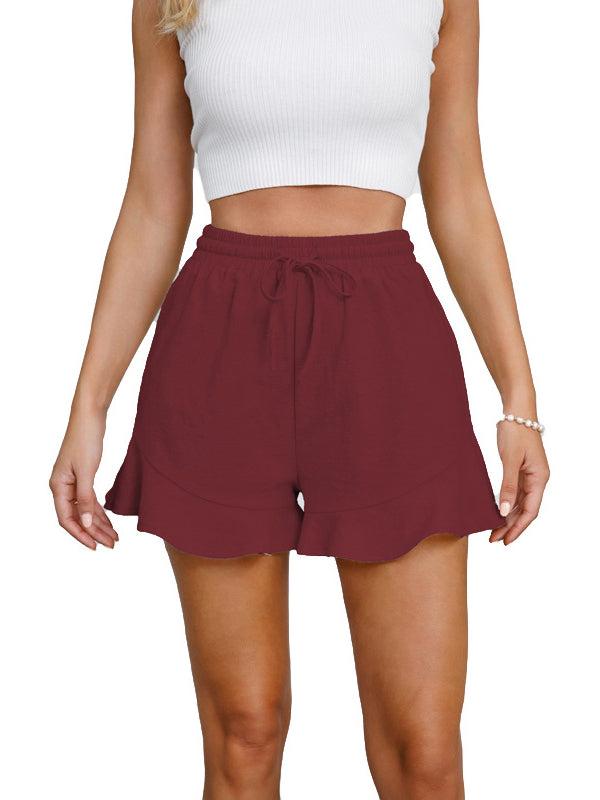 Short ample à jambes larges, à cordon de serrage, à taille élastique, à empiècements, couleur unie