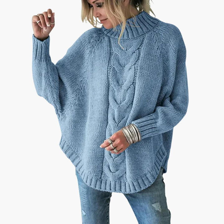 Pull femme avec col roulé et motif en torsades