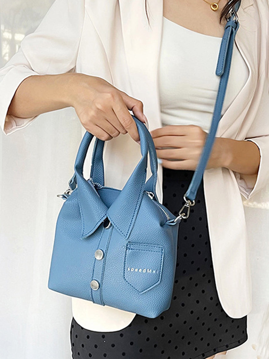 Sac à main bandoulière géométrique boutonné couleur unie