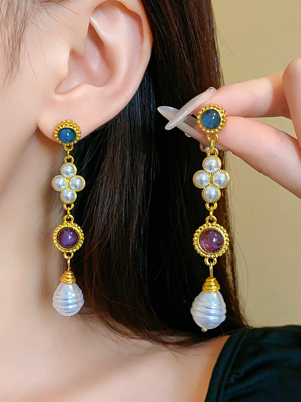 Boucles d'oreilles pendantes géométriques à pompons