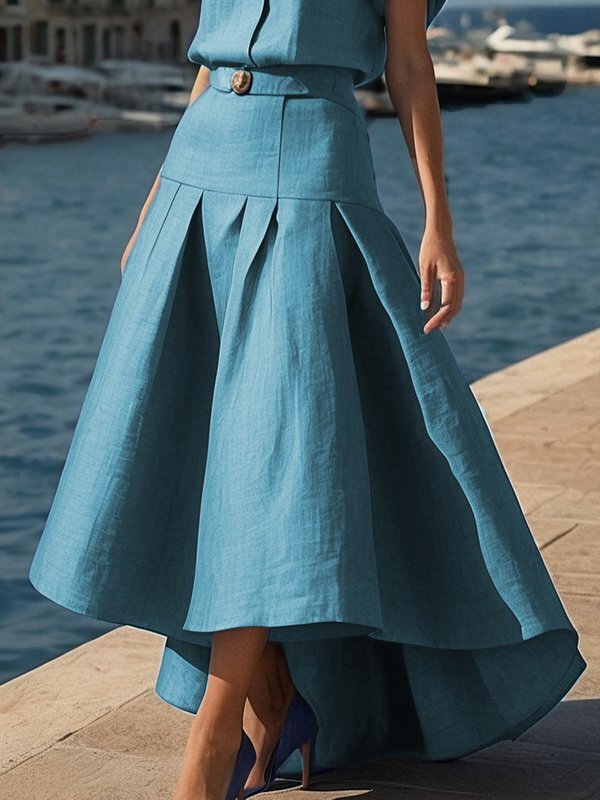 Jupe plissée taille haute, à ourlet plongeant, avec ceinture, couleur unie