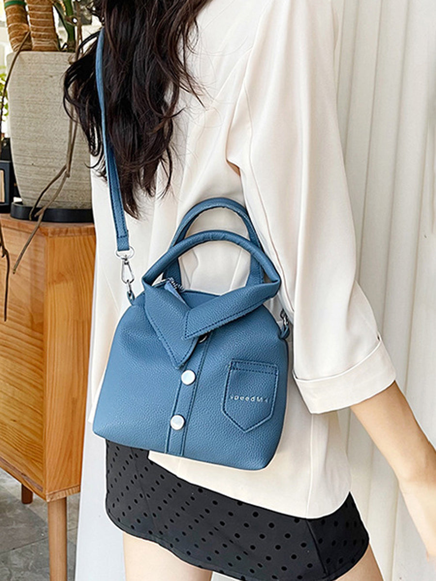 Sac à main bandoulière géométrique boutonné couleur unie