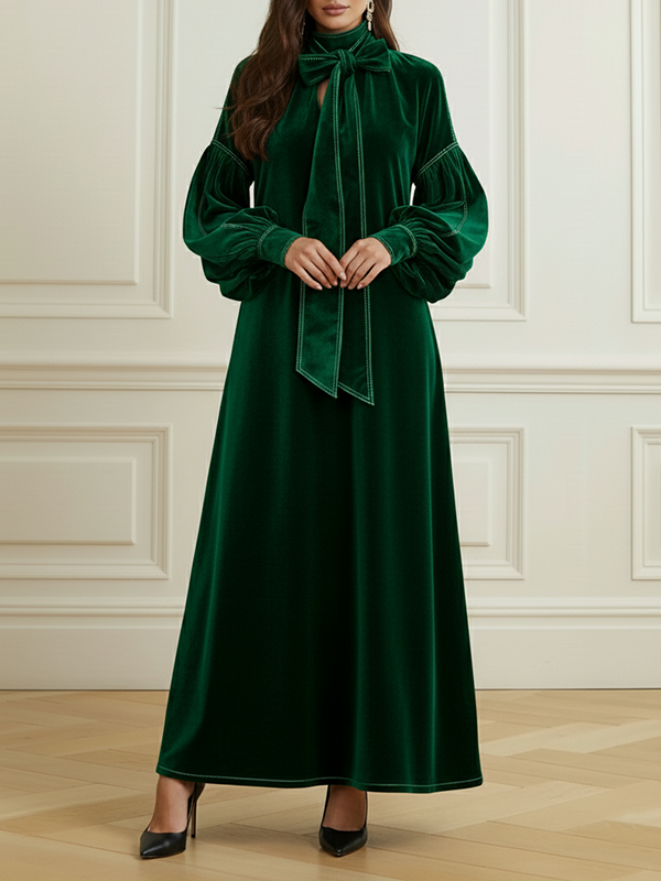 Robe longue plissée coupe trapèze, à manches longues, à nœud, à empiècements, à col haut, couleur unie