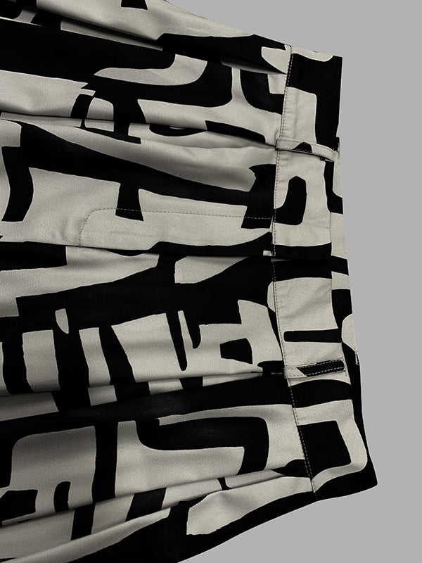 Pantalon ample plissé imprimé taille haute, à empiècements