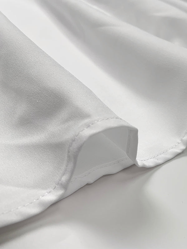 Robe chemise ample plissée coupe trapèze, à empiècements, à col revers, couleur unie