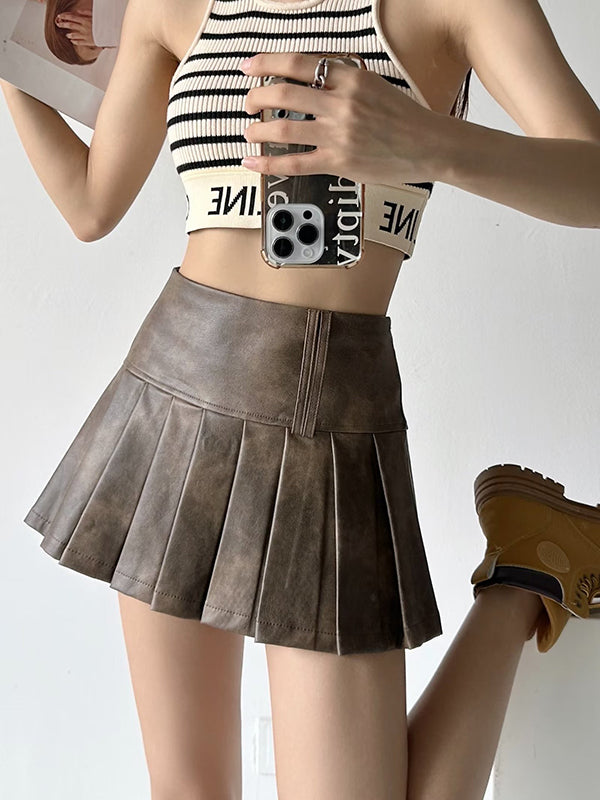 Jupe plissée coupe trapèze, taille haute, couleur unie