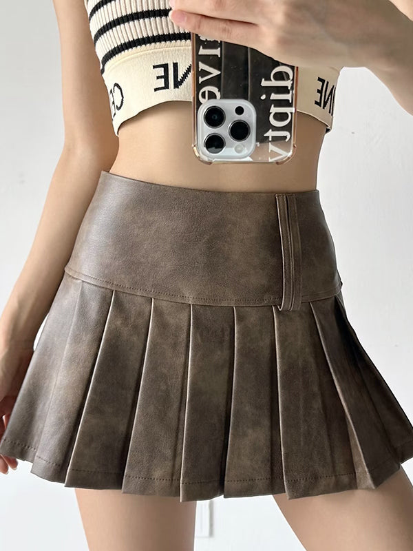 Jupe plissée coupe trapèze, taille haute, couleur unie