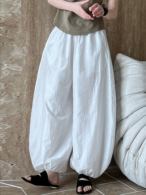 Pantalon taille haute, à taille élastique, à empiècements, couleur unie