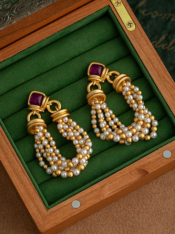 Boucles d'oreilles pendantes géométriques à pompons