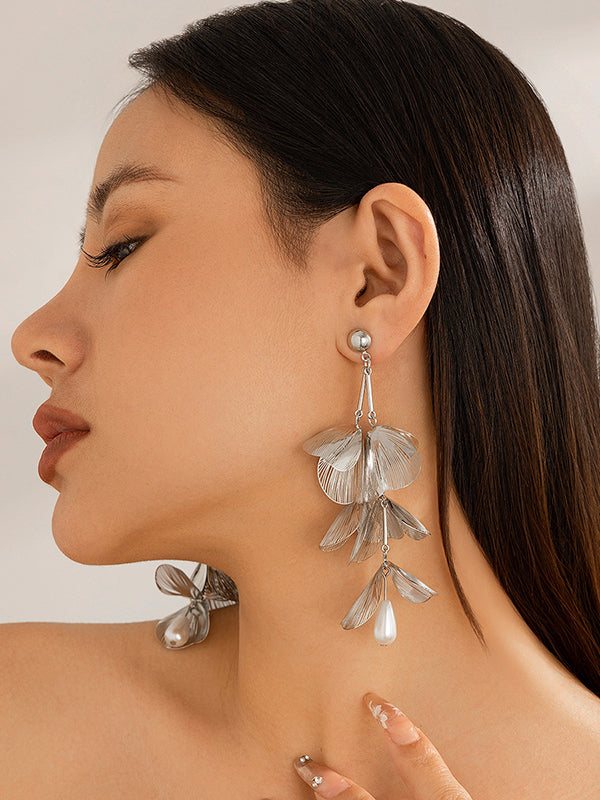 Boucles d'oreilles pendantes géométriques à pompons