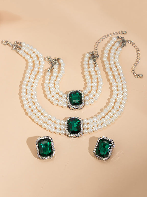 Parure bracelet, collier et boucles d'oreilles géométrique superposée à strass