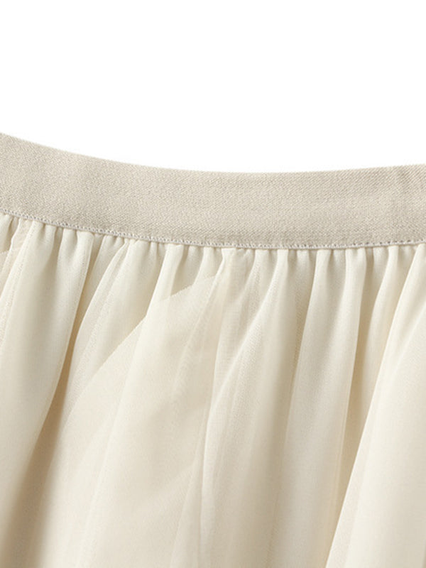 Jupe ample plissée coupe trapèze, à taille élastique, en gaze, à empiècements, couleur unie