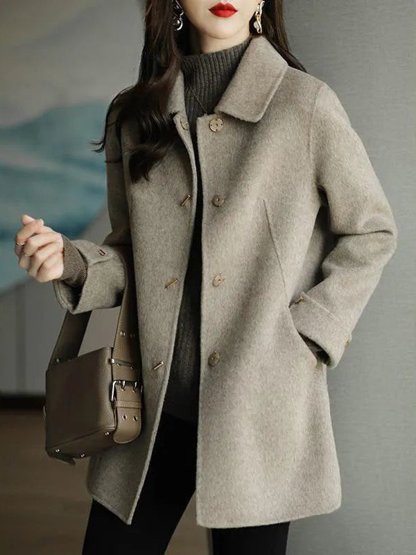 Manteau en laine ample boutonné à manches longues, à poches, à col revers, couleur unie