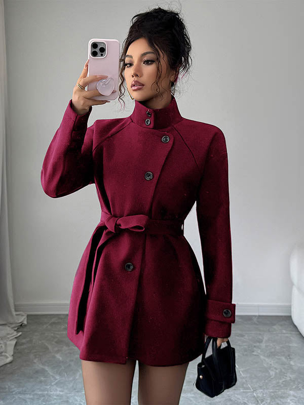 Veste asymétrique boutonnée à taille élastique, taille haute, à taille nouée, à col montant, couleur unie