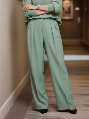 Pantalon ample boutonné plissé couleur unie