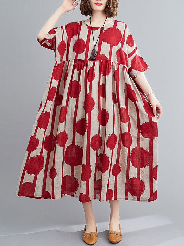 Robe mi-longue à pois, à empiècements, à col rond