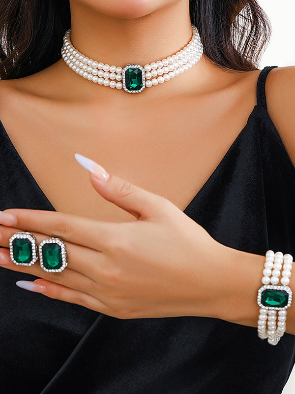 Parure bracelet, collier et boucles d'oreilles géométrique superposée à strass