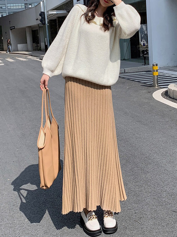 Jupe plissée coupe trapèze, taille haute, couleur unie