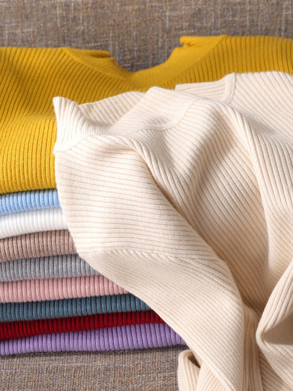 Pull à manches longues, coupe près du corps, à empiècements, à col haut, couleur unie