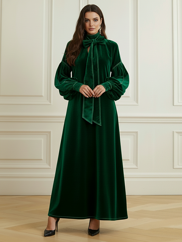 Robe longue plissée coupe trapèze, à manches longues, à nœud, à empiècements, à col haut, couleur unie