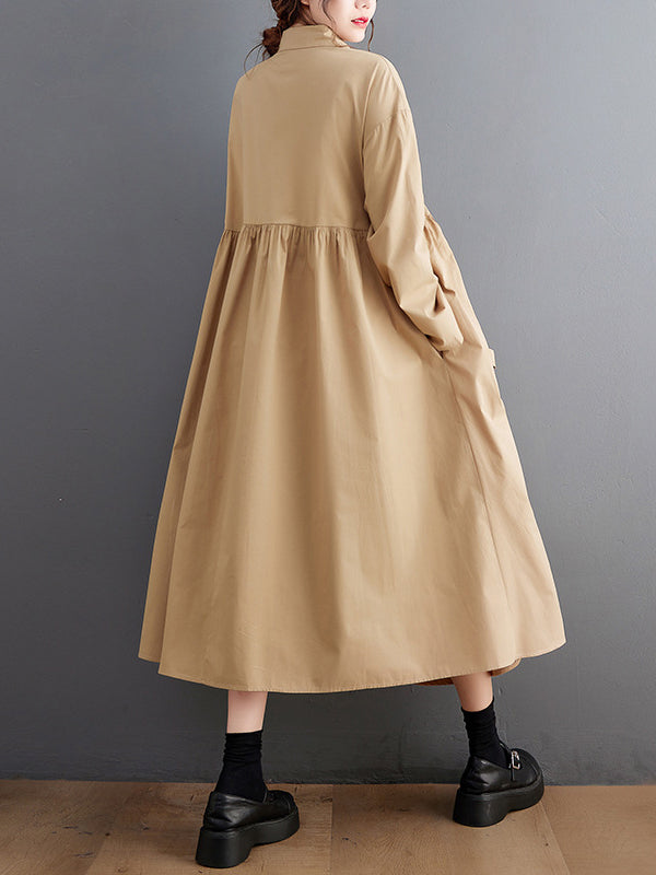 Robe chemise boutonnée plissée nouée coupe trapèze, à manches longues, à poches, à col revers, couleur unie
