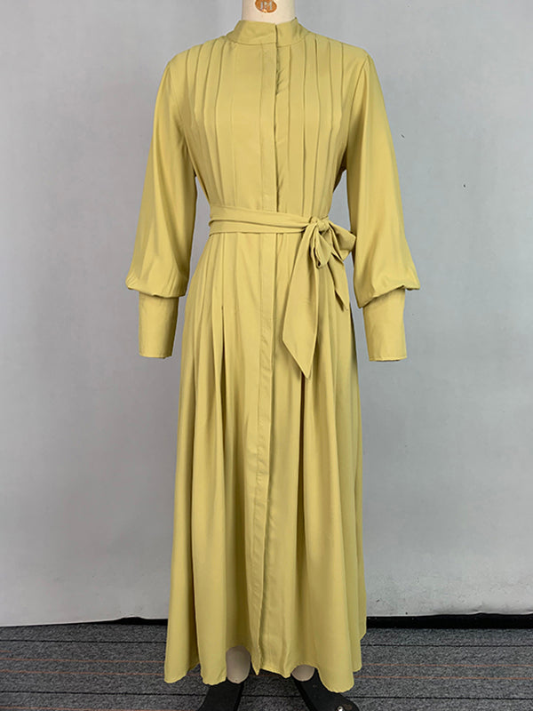 Robe longue boutonnée plissée coupe trapèze, à manches longues, à poches, à taille nouée, à col en V, couleur unie