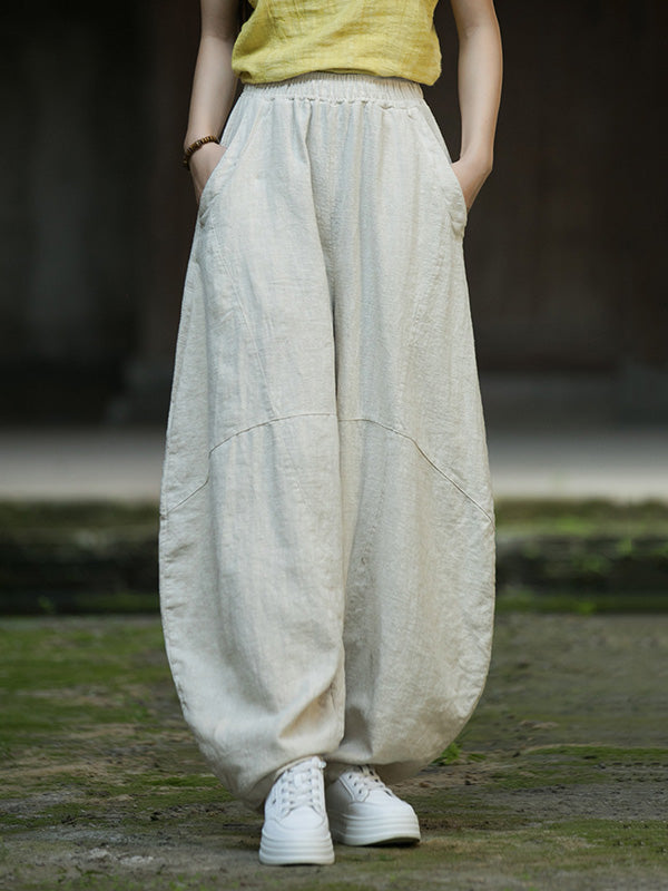Pantalon ample à taille élastique, à poches, à empiècements, couleur unie