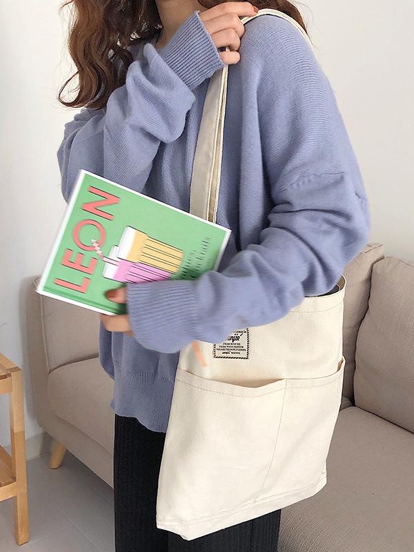 Sac à main simple en toile de couleur unie avec poches
