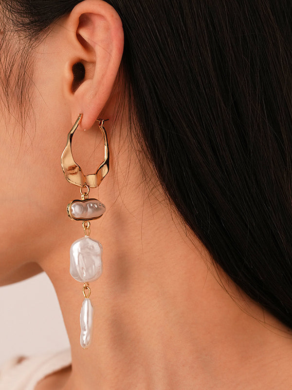Boucles d'oreilles géométriques à pompons