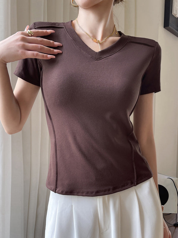 T-shirt à manches courtes, coupe près du corps, à empiècements, à col en V, couleur unie