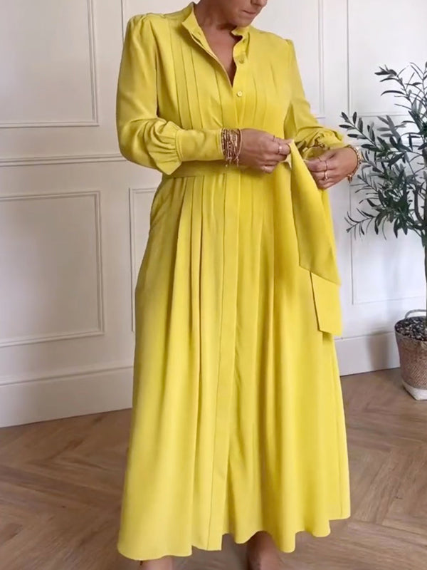 Robe longue boutonnée plissée coupe trapèze, à manches longues, à poches, à taille nouée, à col en V, couleur unie