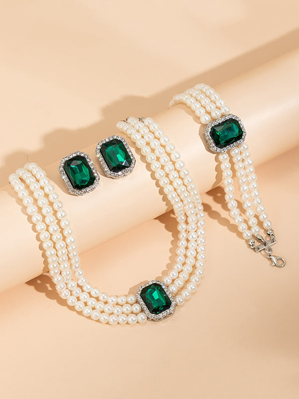 Parure bracelet, collier et boucles d'oreilles géométrique superposée à strass