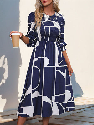 Robe mi-longue imprimée coupe trapèze, taille haute, à taille élastique, à empiècements, à col rond