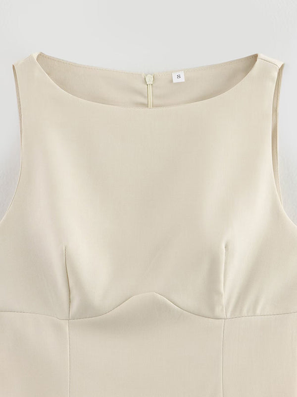 Robe courte ample plissée coupe trapèze, à empiècements, à fermeture éclair, à col rond, couleur unie