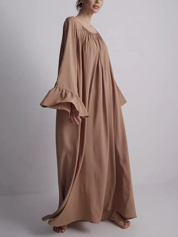 Robe longue plissée coupe trapèze, à manches évasées, à empiècements, à col rond, couleur unie
