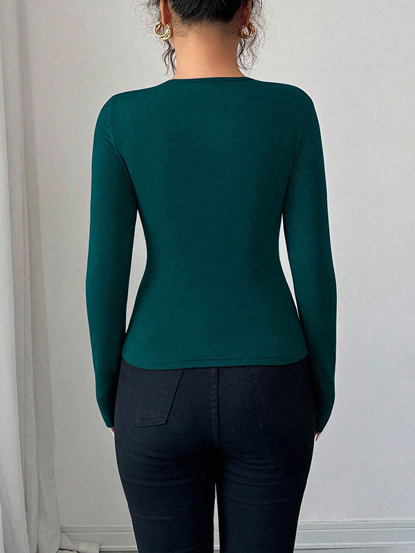 T-shirt à manches longues, coupe près du corps, à empiècements, à col asymétrique, couleur unie