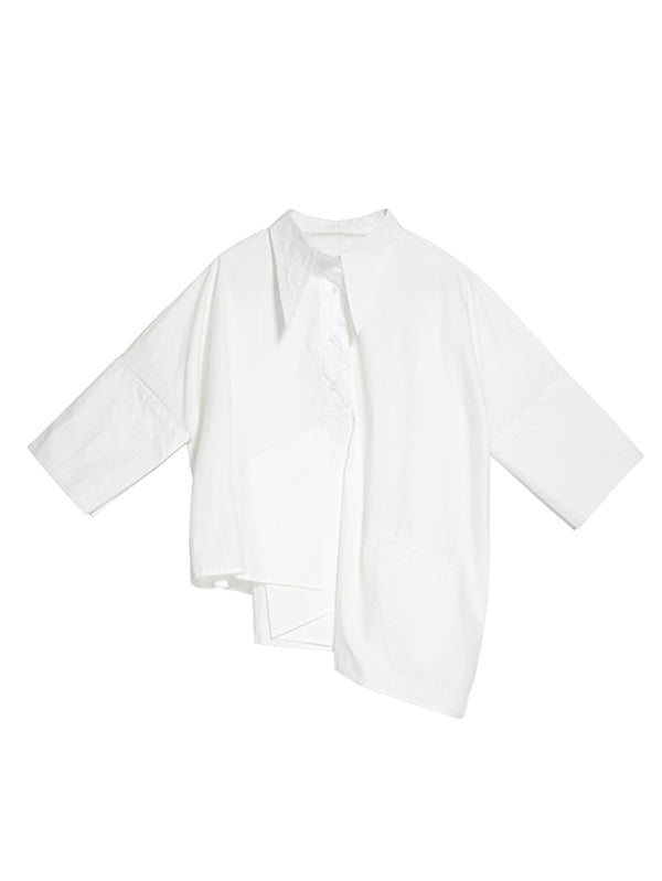 Blouse unie à coupe irrégulière et col revers
