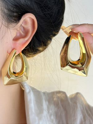 Boucles d'oreilles pendantes géométriques ajourées normcore