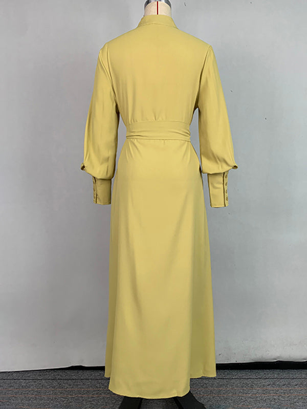Robe longue boutonnée plissée coupe trapèze, à manches longues, à poches, à taille nouée, à col en V, couleur unie