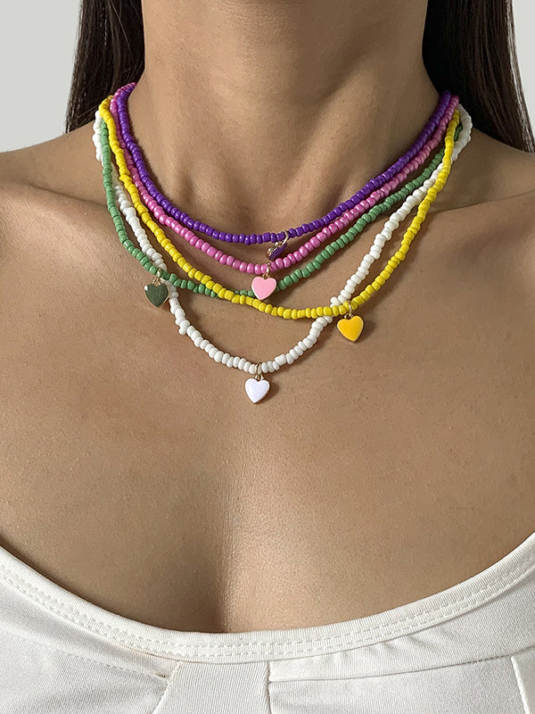 Collier à perles, couleur unie