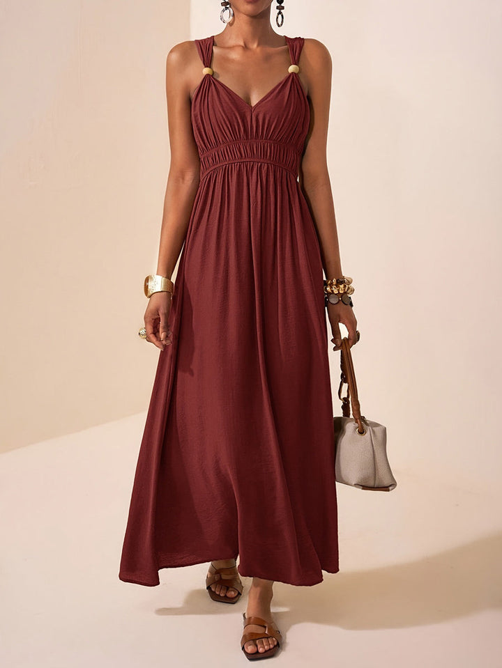 Robe longue ample plissée coupe trapèze, à fines bretelles, couleur unie