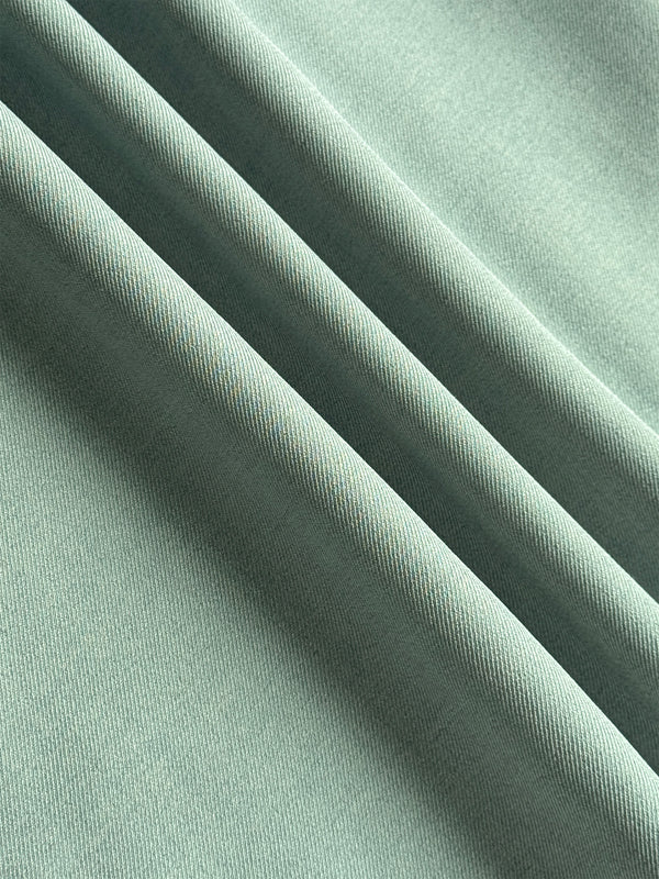 Pantalon ample boutonné plissé couleur unie