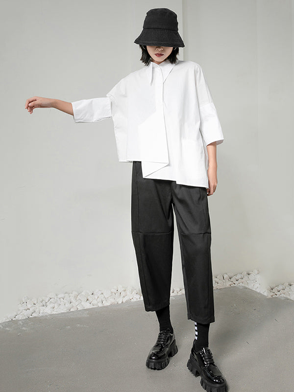 Blouse unie à coupe irrégulière et col revers