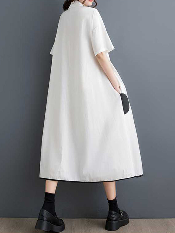 Robe chemise boutonnée fendue devant coupe trapèze, à manches mi-longues, à poches, à pois, à empiècements, à col revers