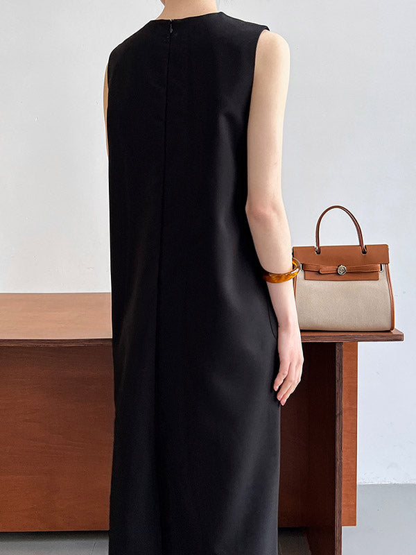 Robe mi-longue ample fendue dans le dos taille haute, à poches, à fermeture éclair, à col rond, couleur unie